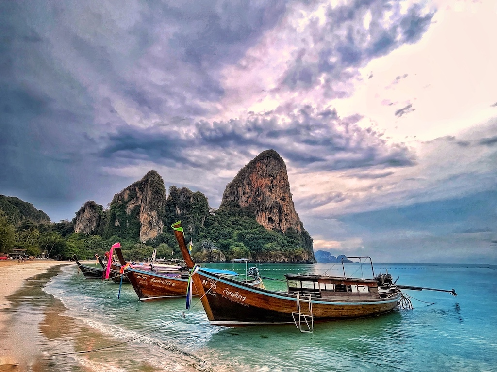 Photo of longtail boats on the shores of Railay Beach, Krabi