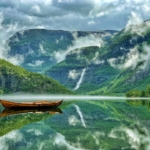 Lake with a boat and mountains in Norway